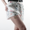 Temporary origami tattoo golden bird from the board "l'origami" applied on a woman's thigh