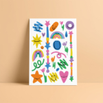 mockup of the Forever Young colored temporary tattoo sheet by Kiki Pocket on an orange background